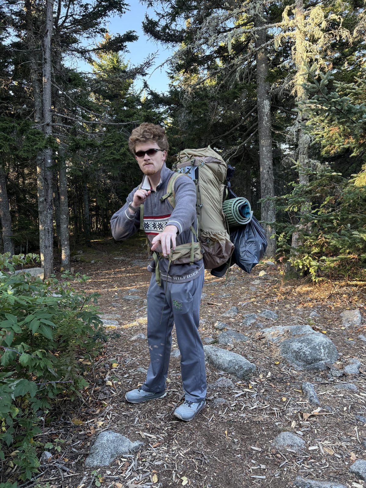 Colin on the trail with a backpack.